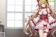 Anime girl with long blonde hair wearing a red and white dress.